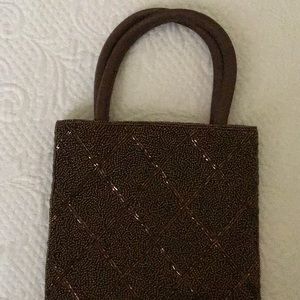 Precious brown beaded clutch with leather strap